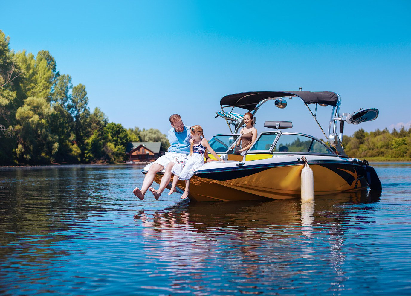 family on a boat in the lake